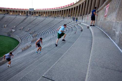 Harvard Students running the Stadium. Source.
